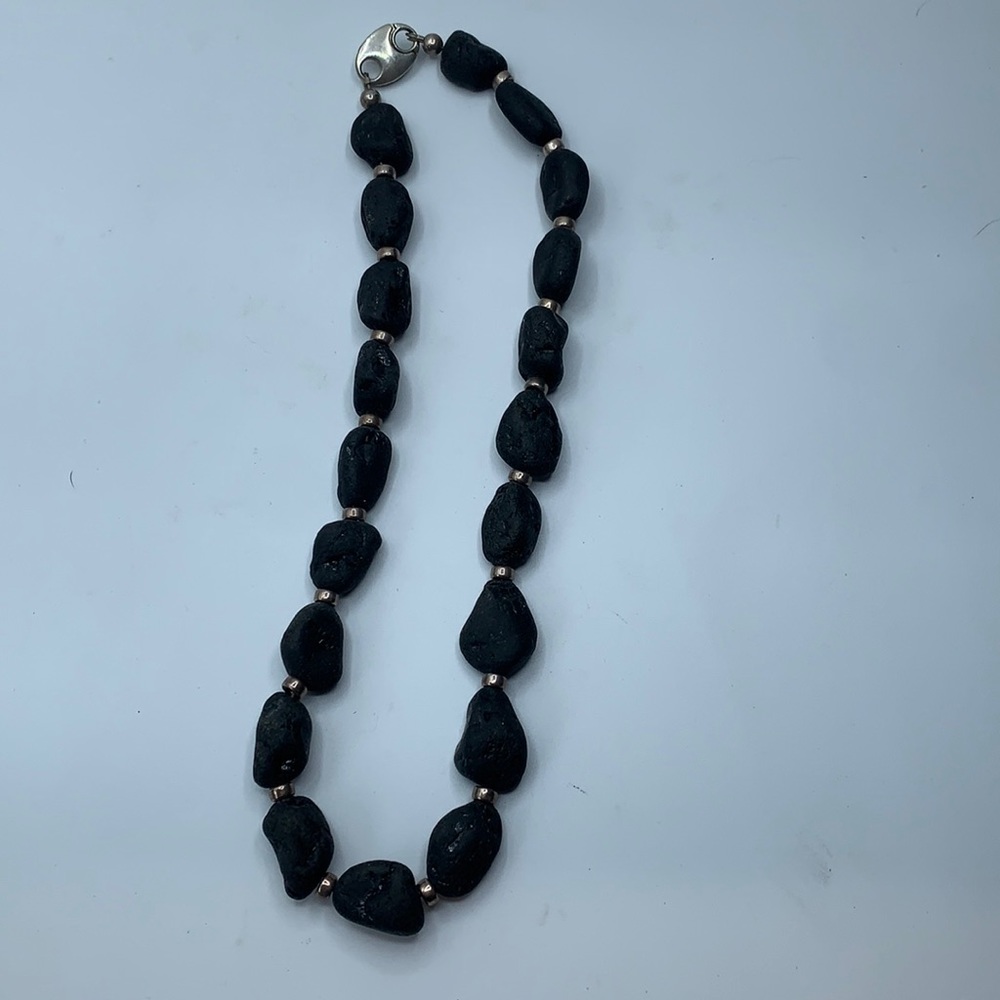 Sterling silver and volcanic stone necklace.